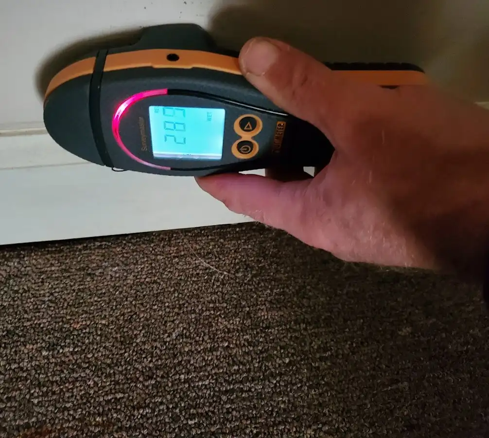 Moisture detection at baseboard during Storm Damage Restoration in Lewisburg